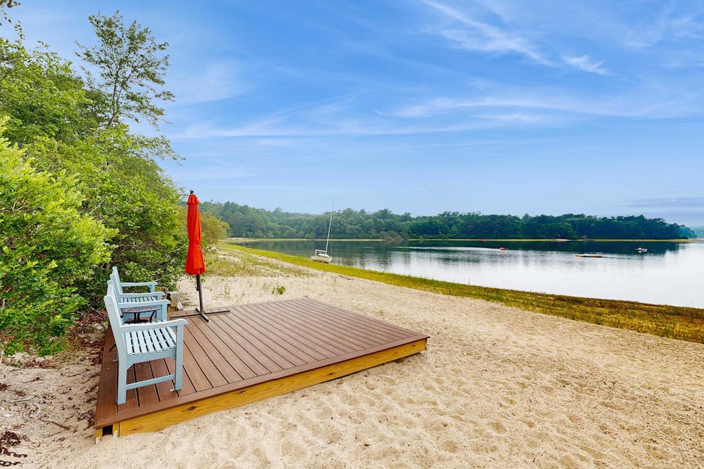 Pondfront escape with private beach, hot tub, sauna, play area & dog-friendly