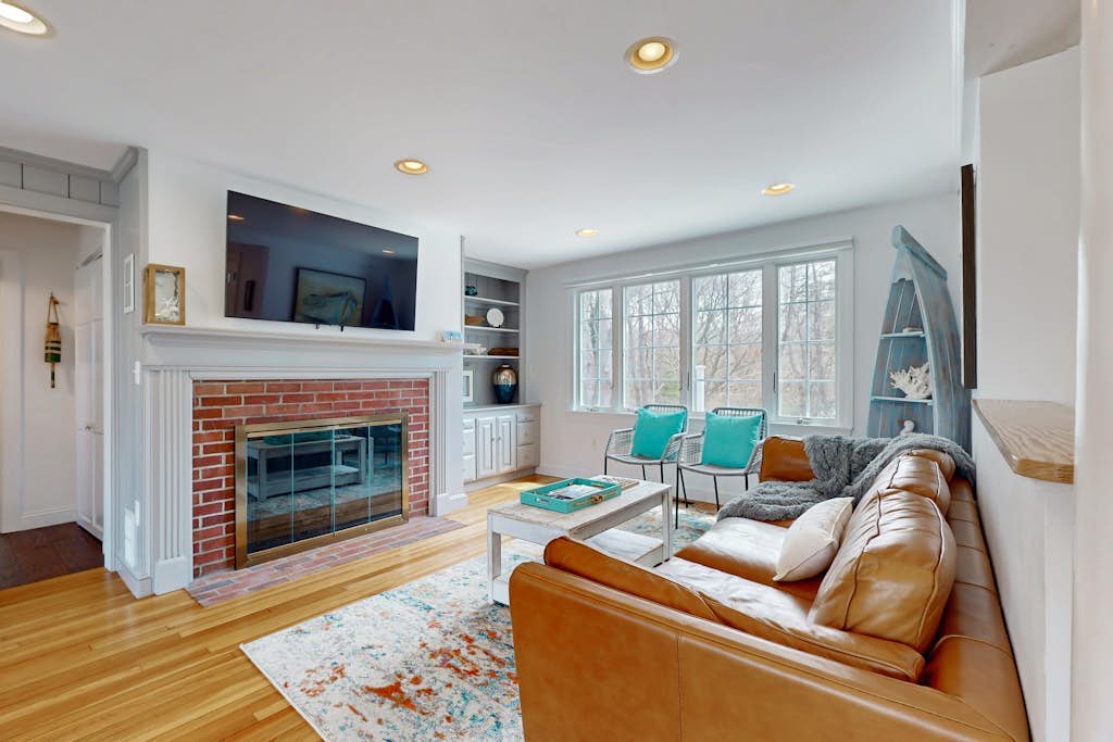 Spacious coastal retreat close to beach with modern kitchen, deck, AC, & sunroom