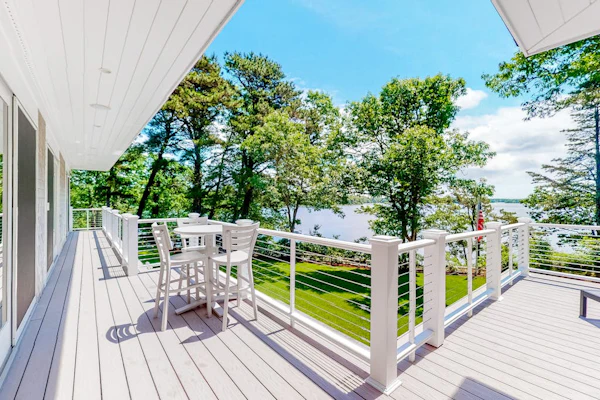 Luxe lakefront home on Follins Pond with private beach, amazing decks & yard