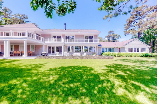 Luxe lakefront home on Follins Pond with private beach, amazing decks & yard