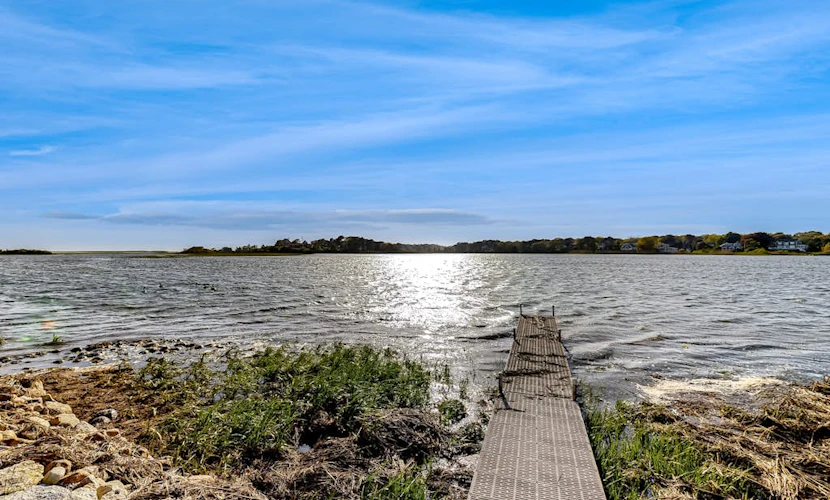 Waterfront house on Bucks Creek Marsh with deck, dock, & kayaks