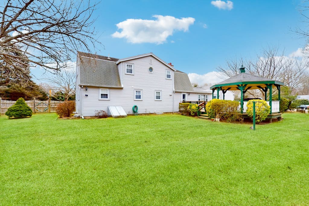Traditional coastal home with large yard, gazebo, grill, smart TVs, washer/dryer