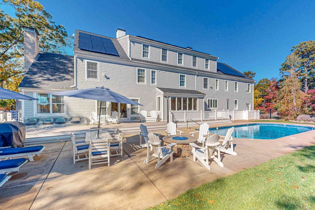 Sprawling dog-friendly lake estate with pool, patio, fire pit, games, & views
