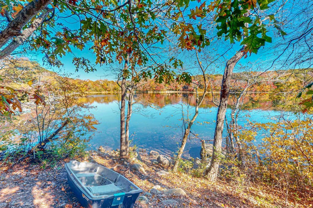 Sprawling dog-friendly lake estate with pool, patio, fire pit, games, & views