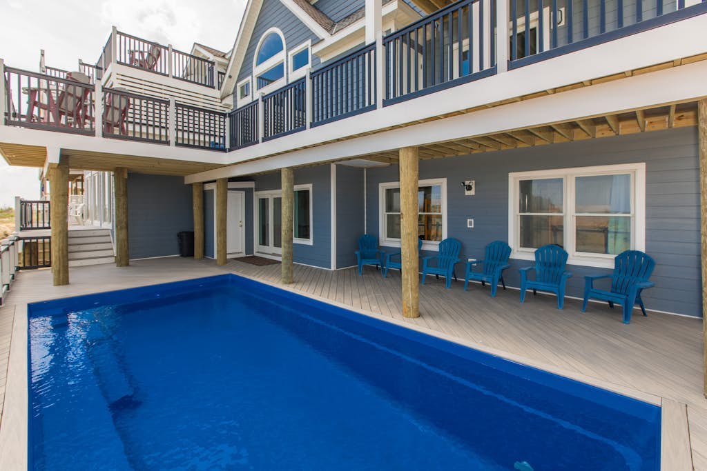 Stunning oceanfront home with private indoor/outdoor pools, game room, theater