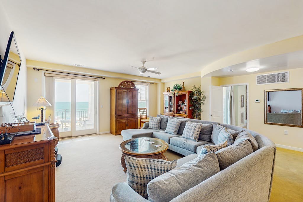 Luxury oceanfront condo on the beach with balcony & pools