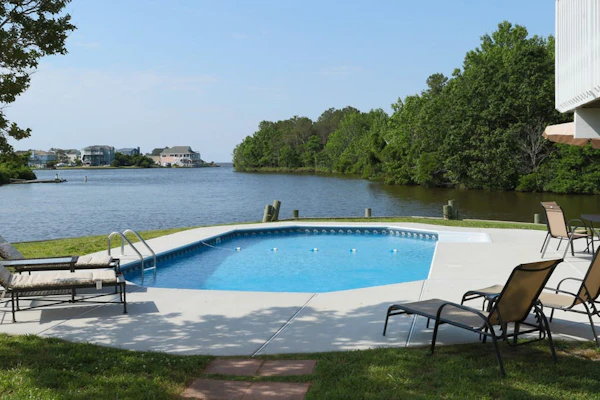 Bayfront dog-friendly retreat w/ private, seasonal pool, decks, game rooms & AC