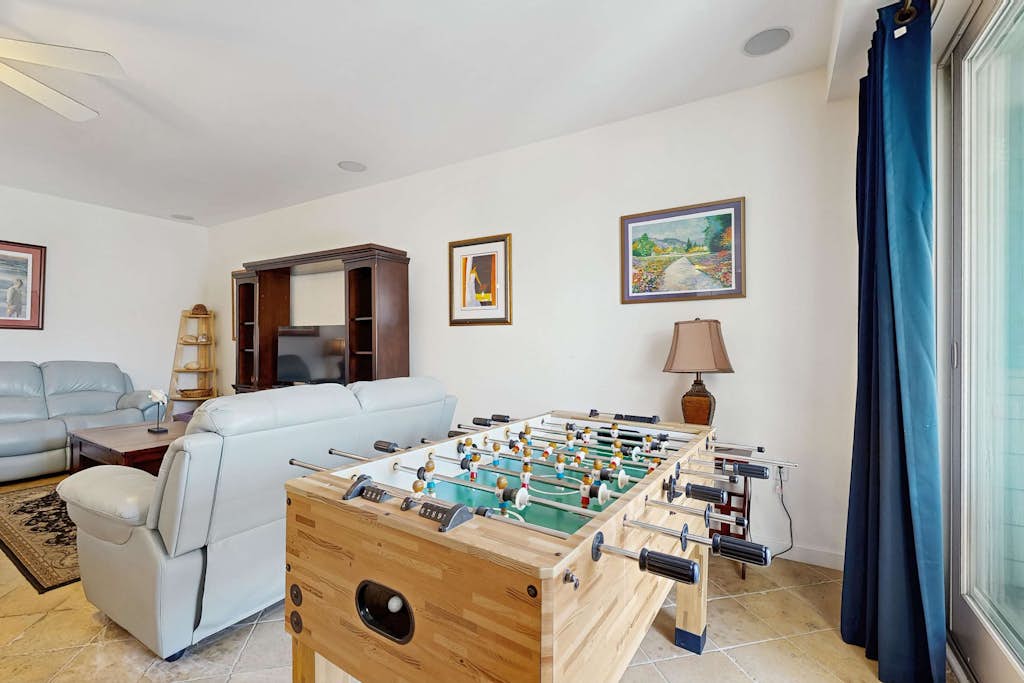 Ocean-view penthouse with balconies, pool, foosball, & gym