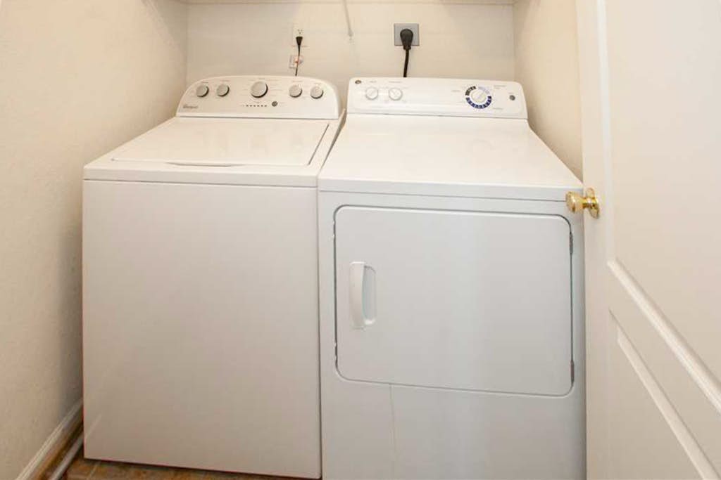 Sunlit 3-story home with private in-ground pool, balcony, washer/dryer