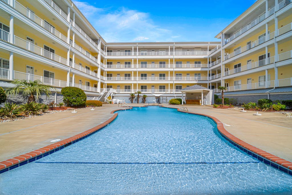 Oceanfront, corner condo with wrap-around deck, great views & on-site pool/gym