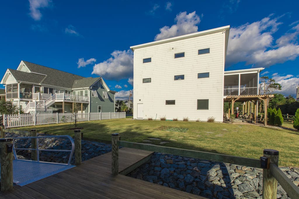 Contemporary home on canal w/elevator, dock, private washer/dryer, central AC