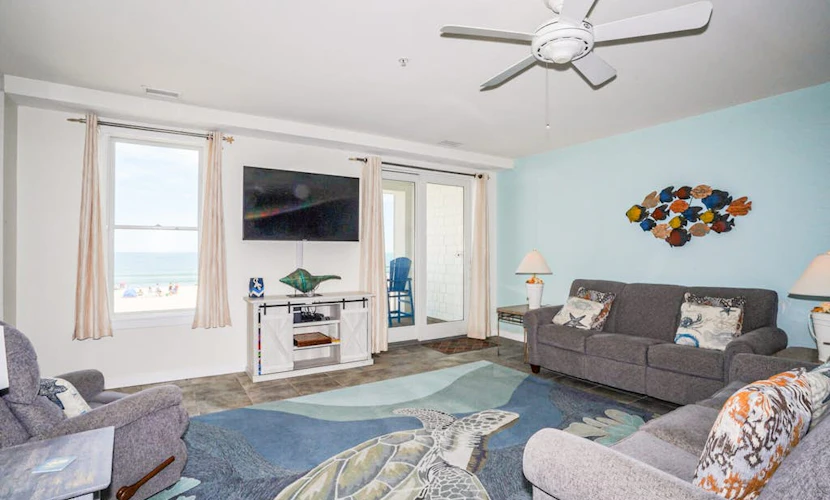 Beachfront condo with 2 oceanfront balconies, W/D, pool, & gym