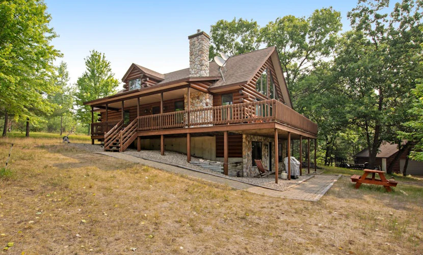 Secluded, dog-friendly home with tree-lined view, firepit, fireplace, & deck