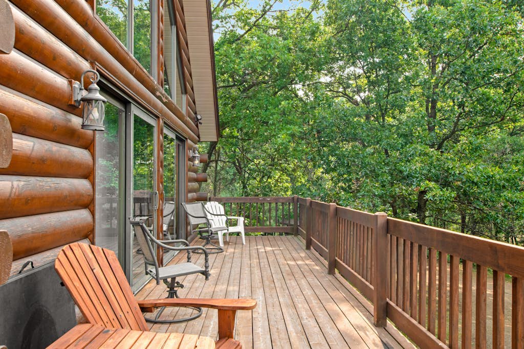 Secluded, dog-friendly home with tree-lined view, firepit, fireplace, & deck