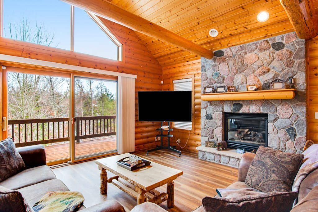 Secluded, dog-friendly home with tree-lined view, firepit, fireplace, & deck
