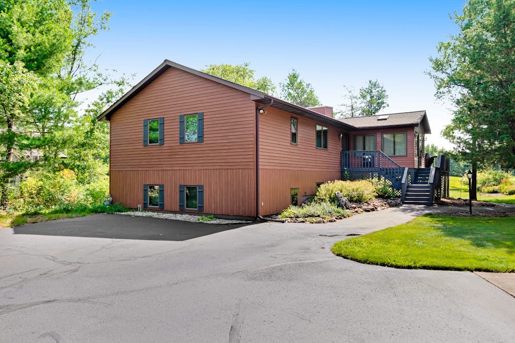 Golf course-front home with 2 pools, private beach, boat launches, tennis, grill