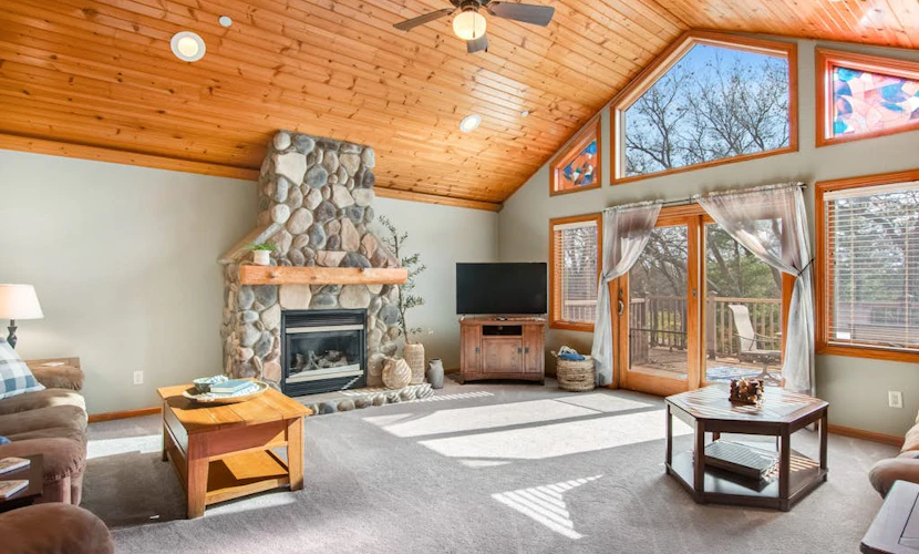 Riverfront golf resort condo with pool, hot tub, volleyball, & fairway-view deck