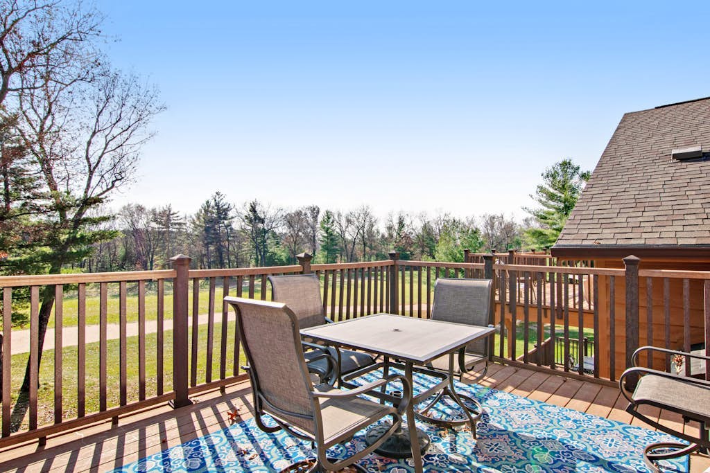 Riverfront golf resort condo with pool, hot tub, volleyball, & fairway-view deck