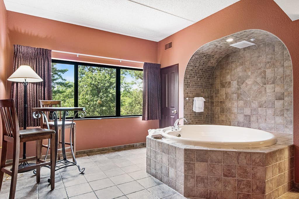 Serene river-view condo with in-room jetted tub & two fireplaces
