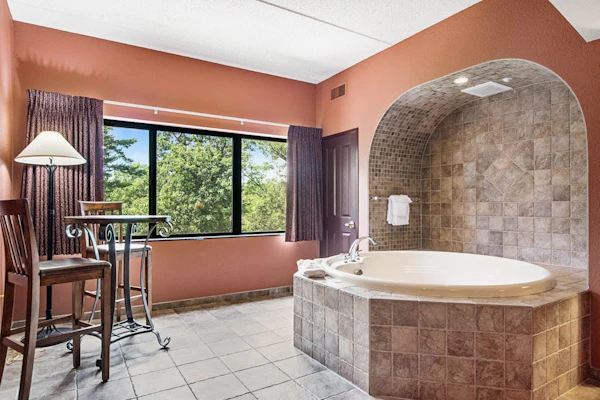 Serene river-view condo with in-room jetted tub & two fireplaces