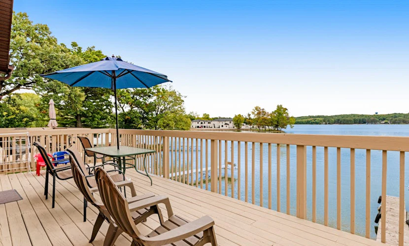 Lakefront dog-friendly condo near skiing with private beach access, views & dock