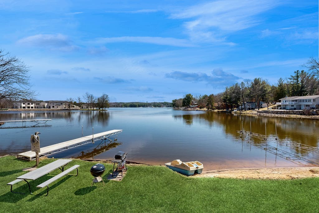 Inviting lakefront condo - amazing views, beach access, fireplace, dock, AC, W/D