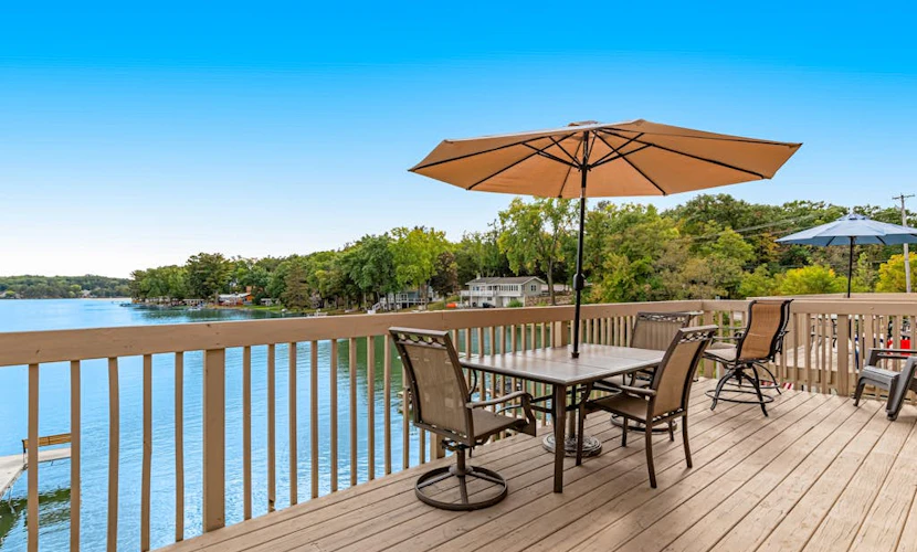 Lakefront condo with deck, amazing views, private beach access, fireplace & dock