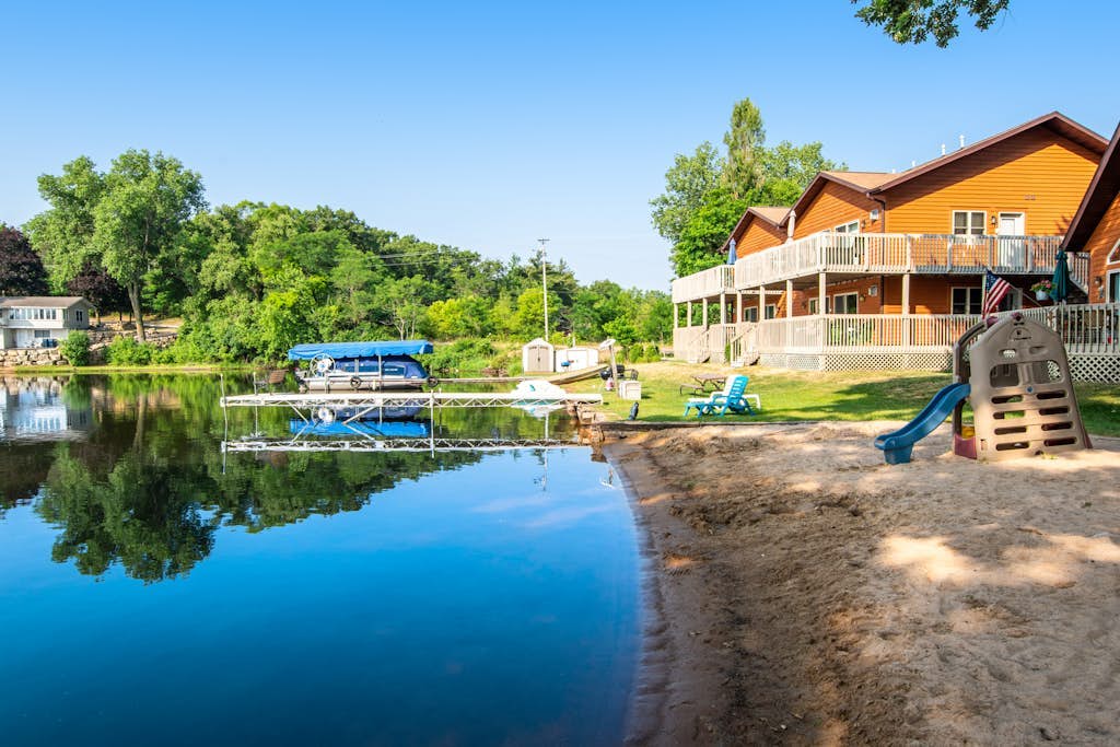 Inviting lakefront retreat - amazing views, beach access, dock & inviting deck