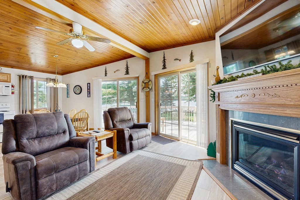 Lakefront retreat with panoramic views, large backyard, & direct beach access