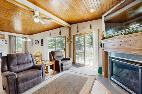 Lakefront retreat with panoramic views, large backyard, & direct beach access