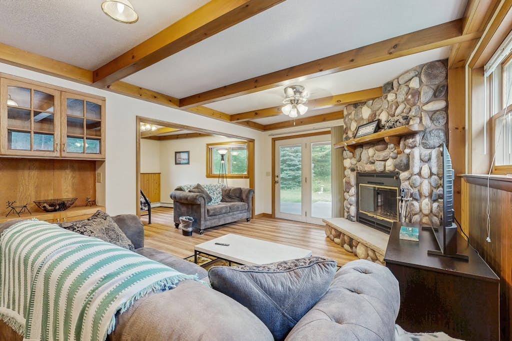 Two-family retreat with 2 kitchens, wooded charm near lakes, trails & adventure