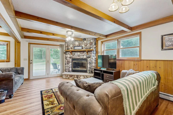 Two-family retreat with 2 kitchens, wooded charm near lakes, trails & adventure