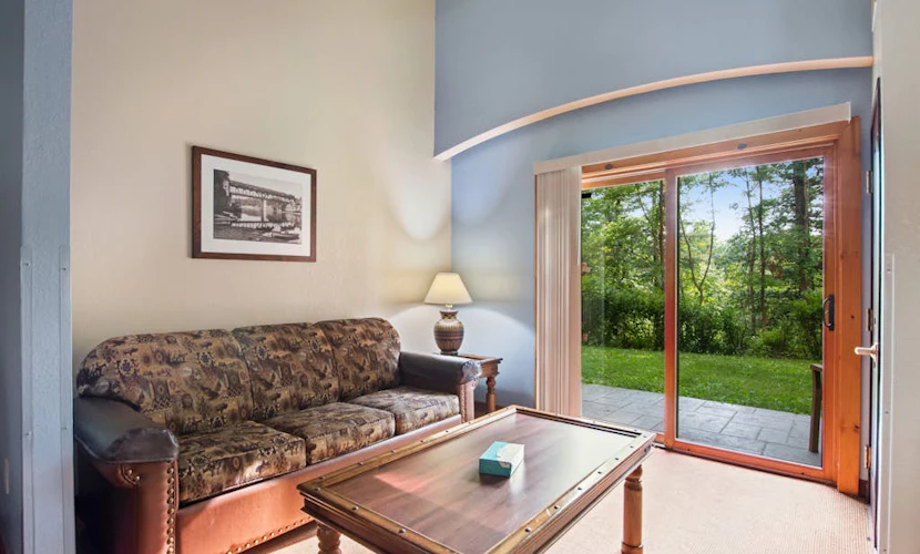 Ground-floor condo with mini-fridge, central AC, & patio