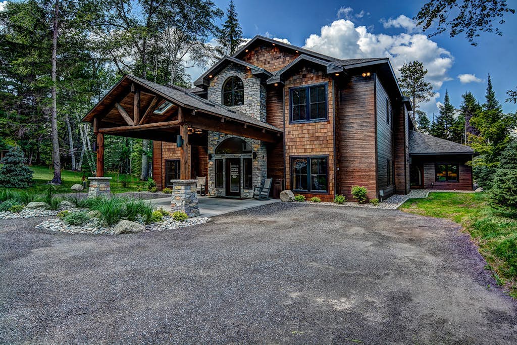 Plush lakefront lodge with private dock, high-speed WiFi, & game room