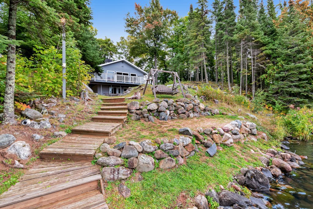 Beautiful home on High Lake w/private pier, large deck & canoes
