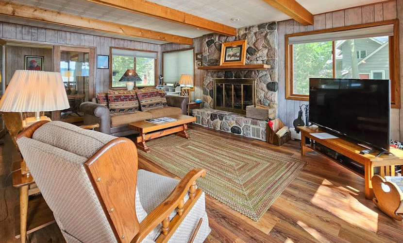 Waterfront home between 2 lakes w/ heated porch, dock & kayaks