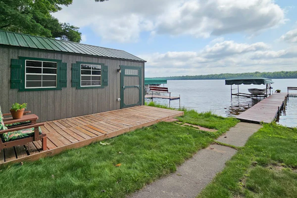 Waterfront home between 2 lakes w/ heated porch, dock & kayaks