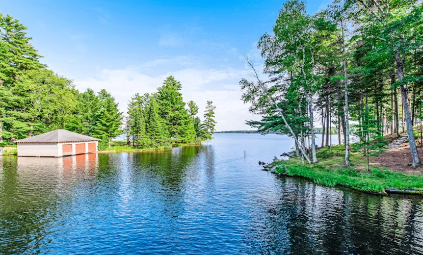 Dog-friendly, lakefront getaway w/ a wraparound balcony, beach, & boat access