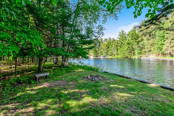 Dog-friendly, lakefront getaway w/ a wraparound balcony, beach, & boat access