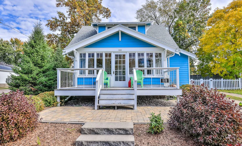 Charming lakefront home with shared dock, porch, & sunroom - walk downtown