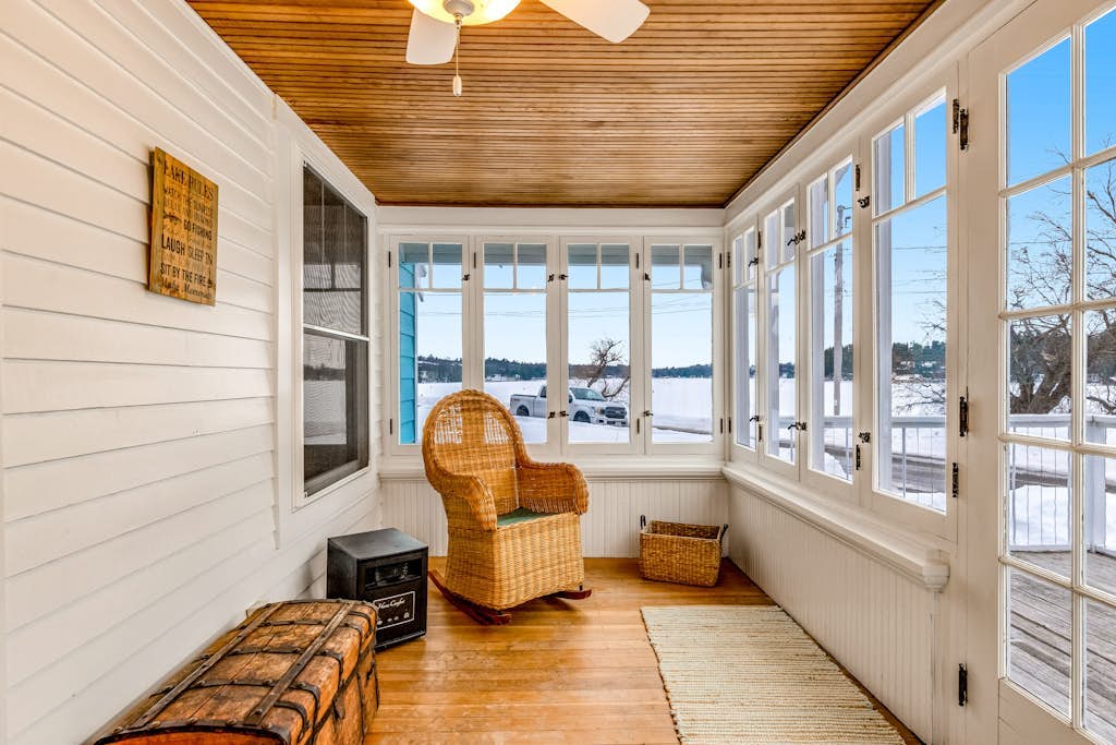Charming lakefront home with shared dock, porch, & sunroom - walk downtown