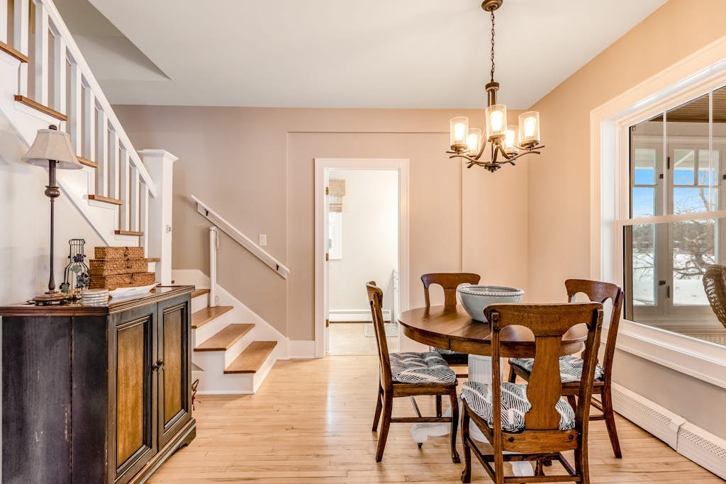 Charming lakefront home with shared dock, porch, & sunroom - walk downtown