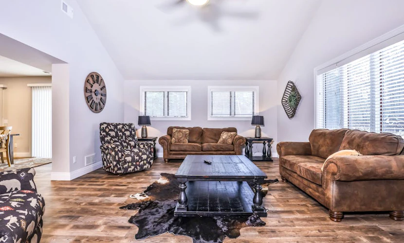 Updated, tree-lined home on the snowmobile trail with gas fireplace & firepit