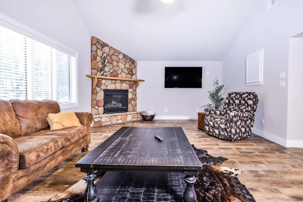 Updated, tree-lined home on the snowmobile trail with gas fireplace & firepit