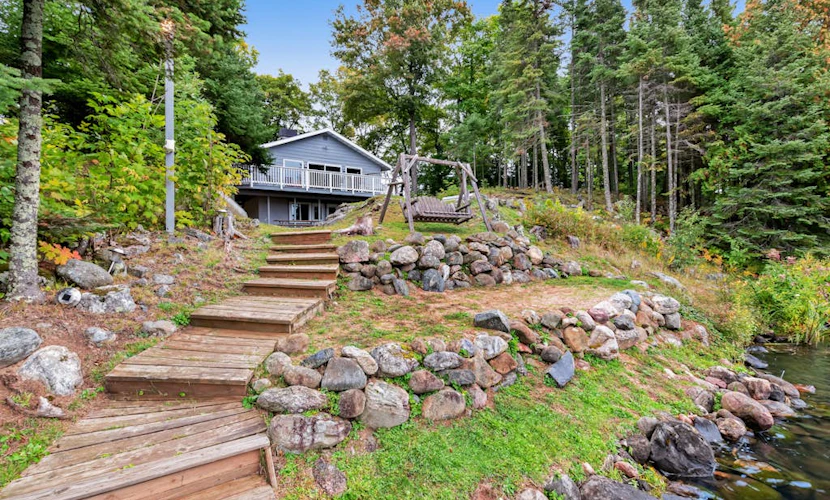 Spacious lakefront home with pier views, canoe, and fire pit - family-friendly