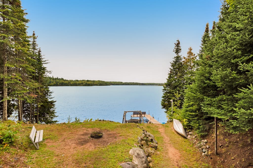 Spacious lakefront home with pier views, canoe, and fire pit - family-friendly