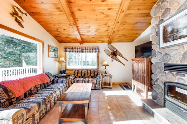 Spacious lakefront home with pier views, canoe, and fire pit - family-friendly