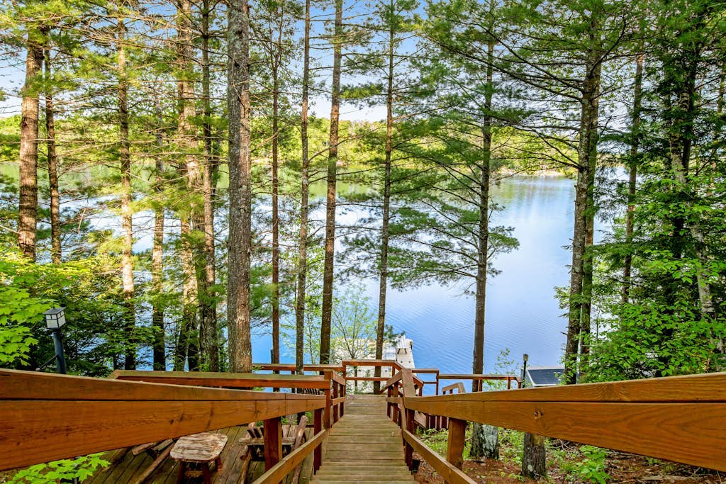 Lakefront dog-friendly gem with private dock, wood stove, large deck & free WiFi