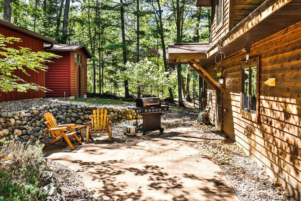 Waterfront getaway with wood fireplace, dock, & lakeside deck