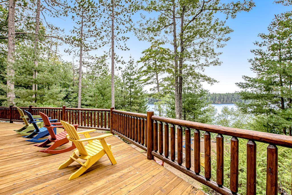 Lakefront log cabin on 3.5 acres with dock, gazebo & sunset views - dog-friendly
